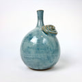 Blue teardrop vase with flower