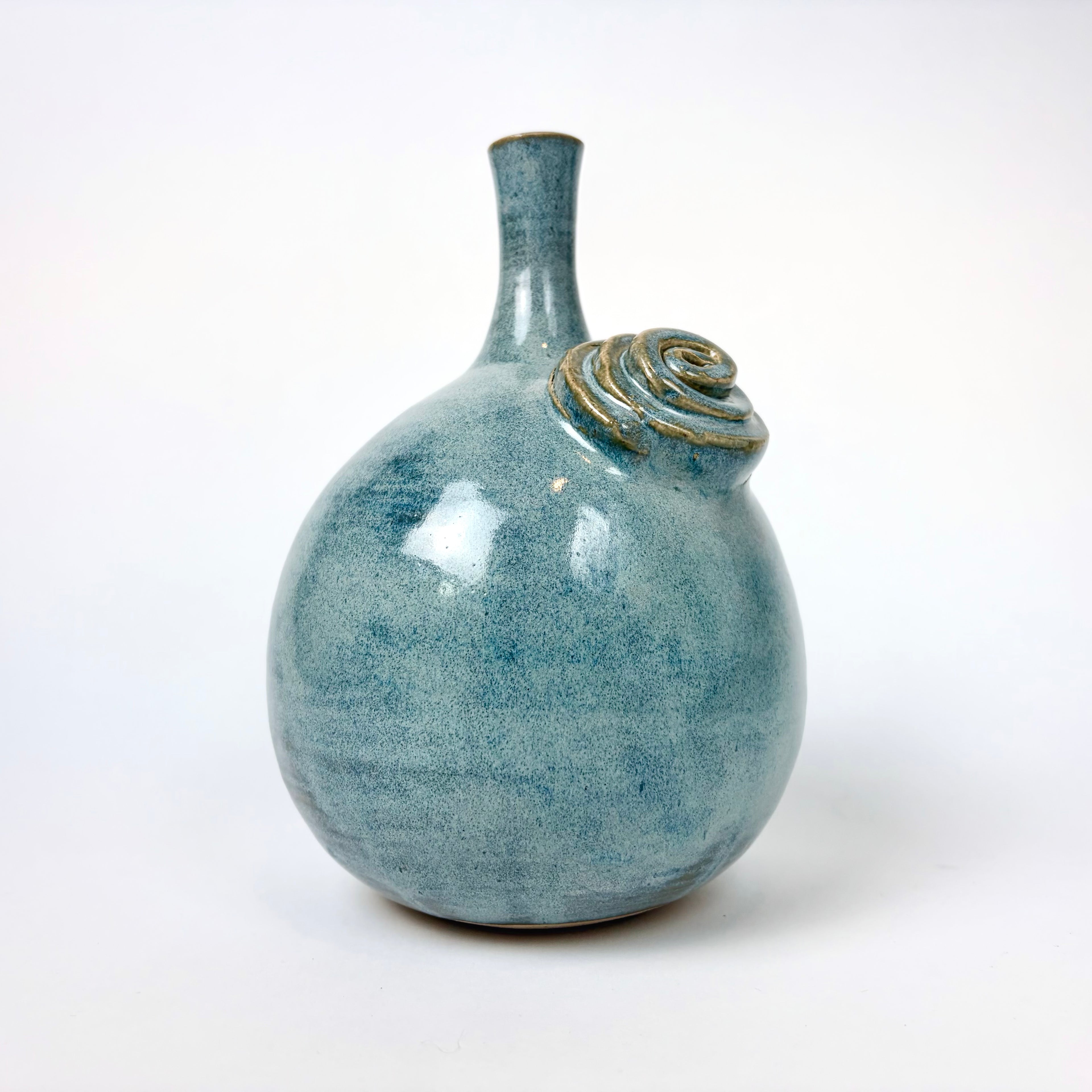 Blue teardrop vase with flower